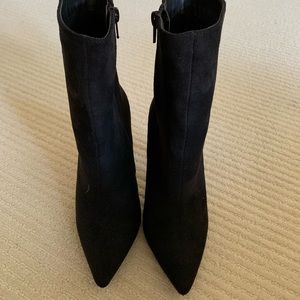 Stiletto booties with zippers. Never worn.